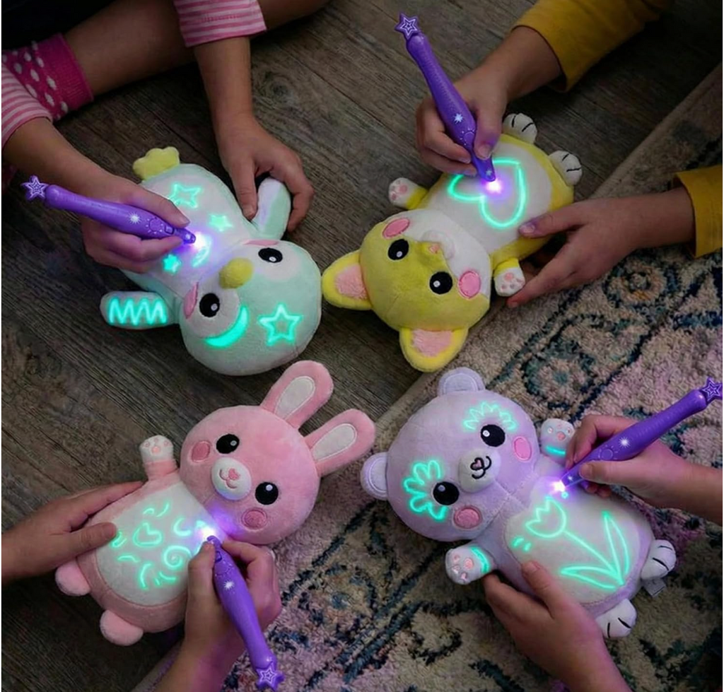 Four kids drawing glowing shapes on their plushies